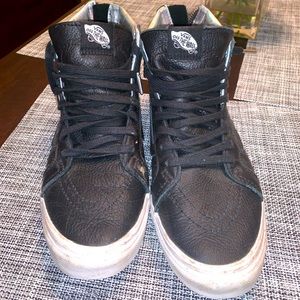 Women’s high top black leather vans
